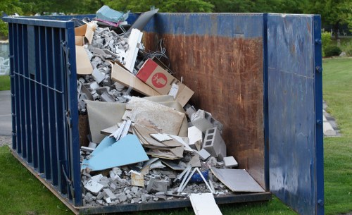 Professional team planning furniture clearance with clients in Docklands